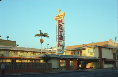 The Hollywood Premiere Motel's vintage neon sign catching the last warm light of the day
