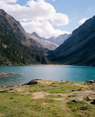 Turquoise alpine lake cradled by the high peaks of the French Pyrenees